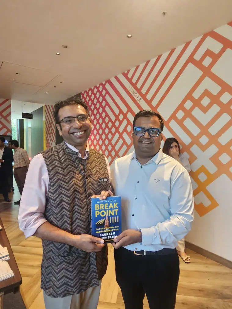 Vikas Agrawal with Saurabh Mukherjea of Marcellus, holding the book Break Point